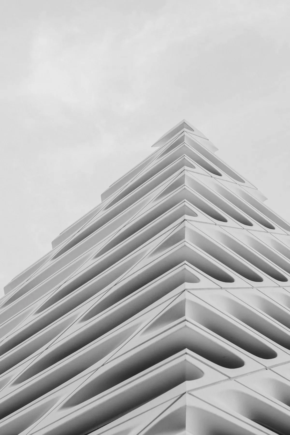 Stepped white facade against a pale sky