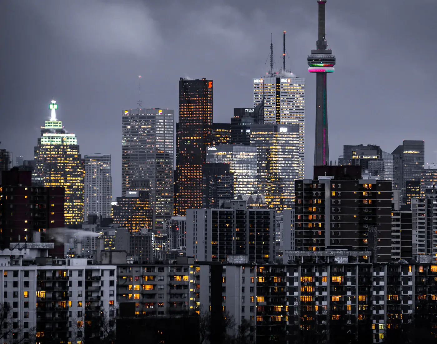 City skyline of corporate towers at dusk, home to international law firms