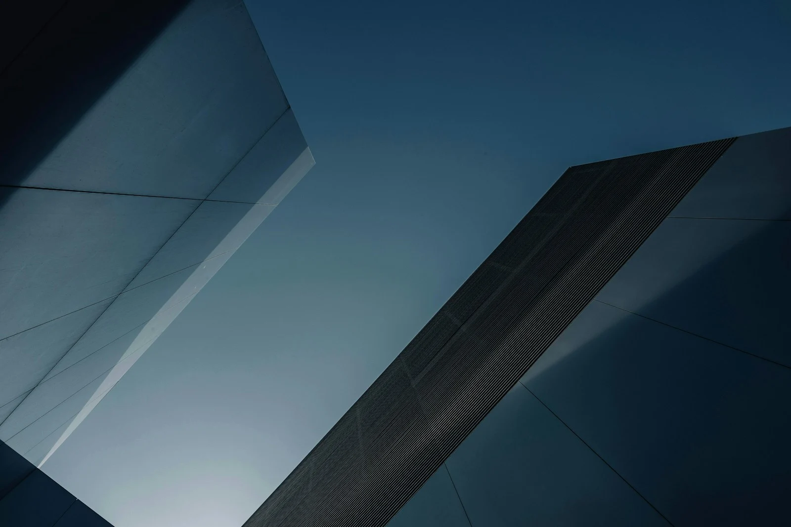 A tall building rising into an open sky