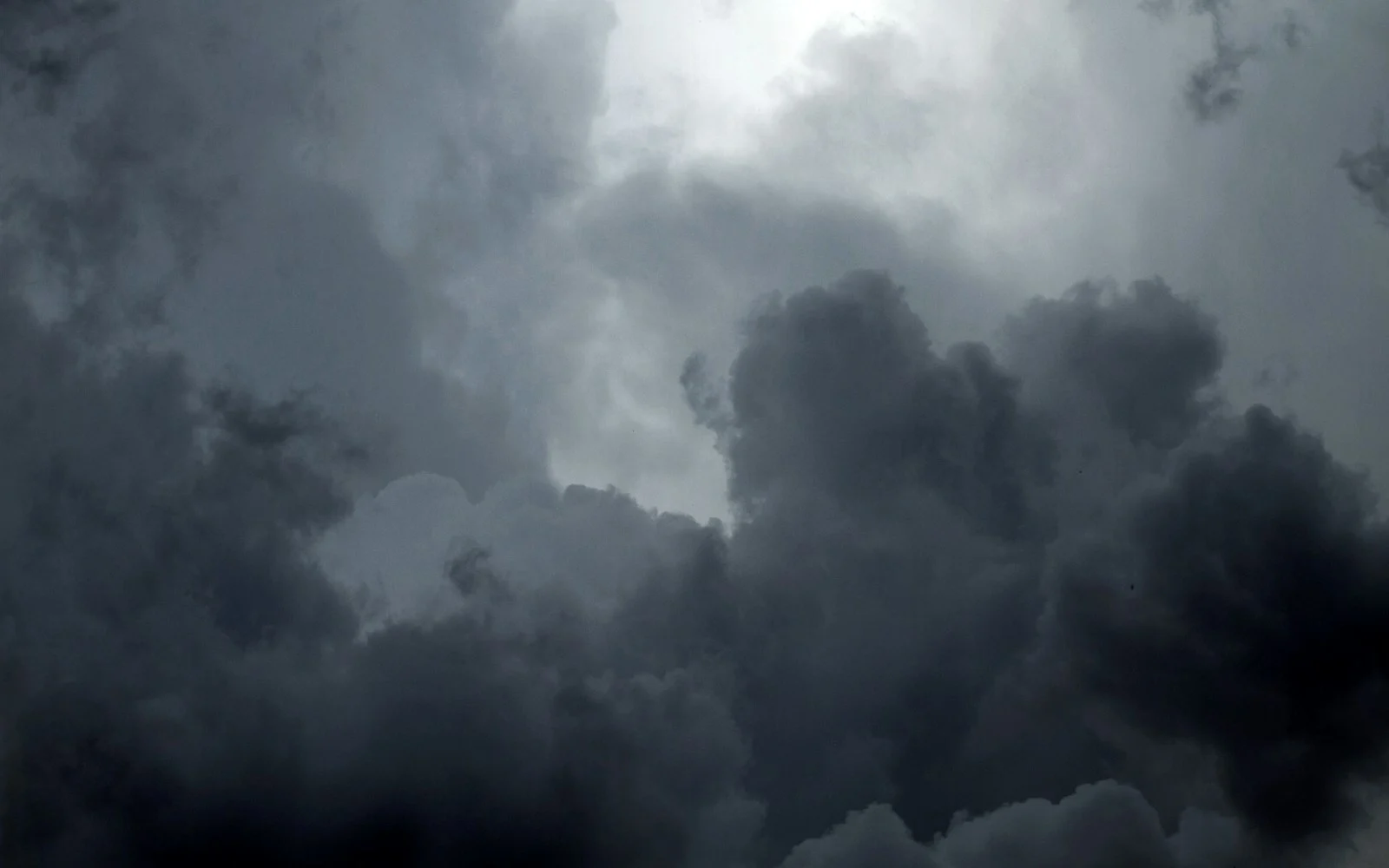 A sky packed with heavy, dark clouds
