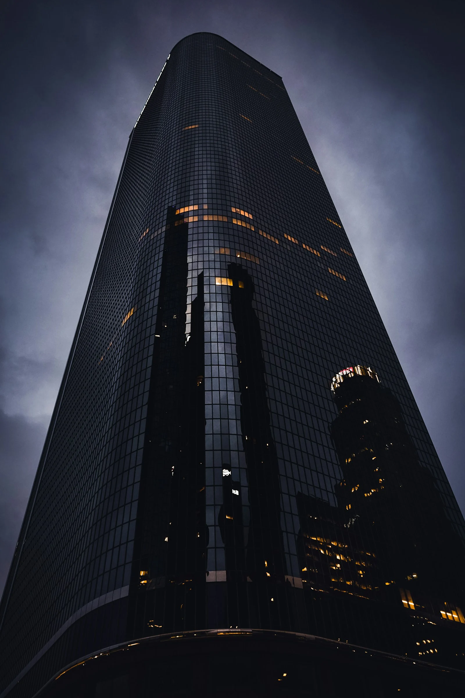 A very tall building with many lights on it at night