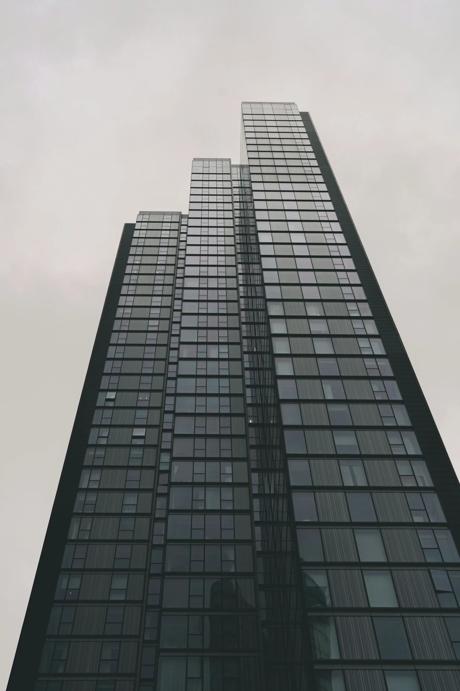 A very tall glass building with many windows